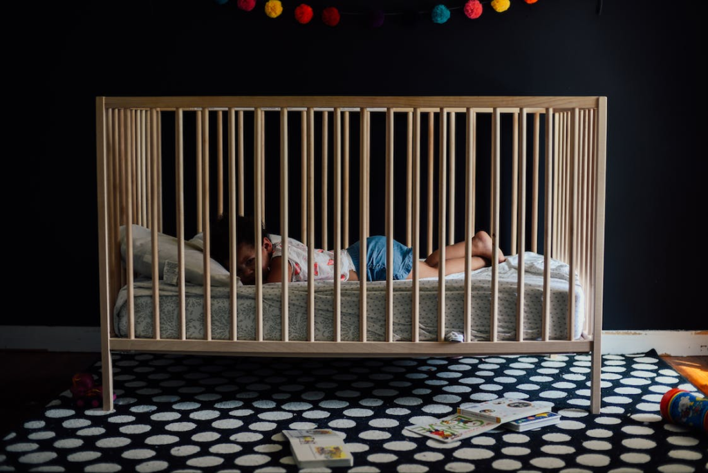 a baby sleeping in the crib in the nursery